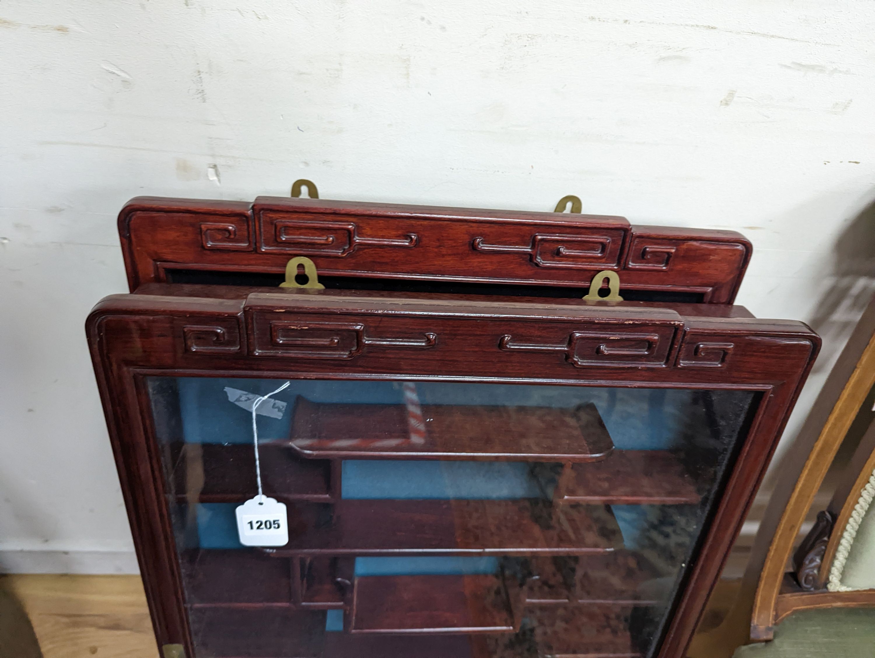 A pair of Chinese hardwood snuff bottle cabinets, width 52cm, height 83cm